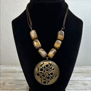 Vintage Avon bronze-tone medallion and genuine tigers eye necklace on suede cord
